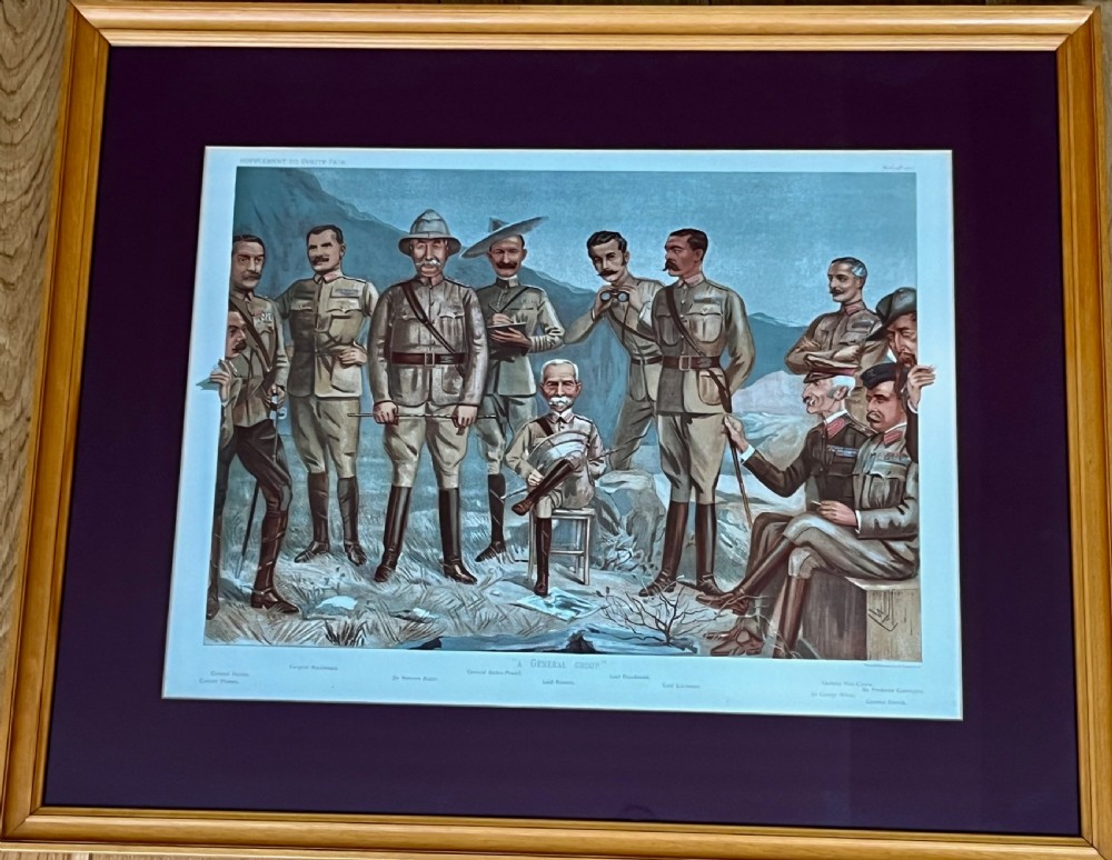 A framed Victorian Vanity Fair chromolithograph featuring group caricatures of late nineteenth-century figures, presented with a dark magenta mount and a light wood frame. View VIII