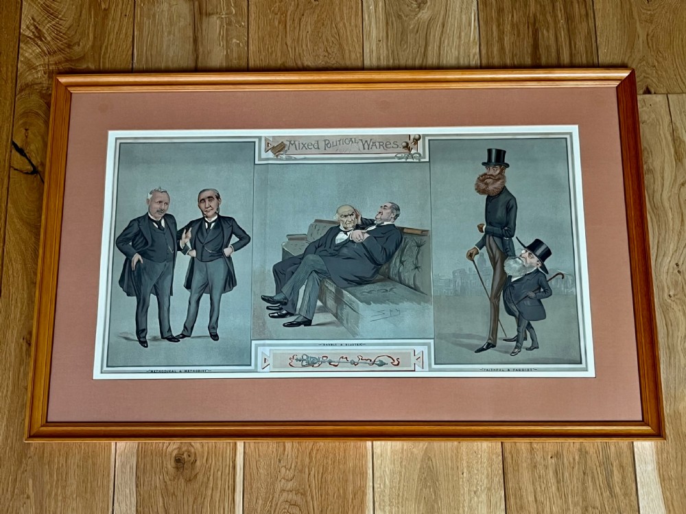 A framed 19th-century Vanity Fair chromolithograph featuring political caricatures by Spy set within a terracotta mount and wooden frame.