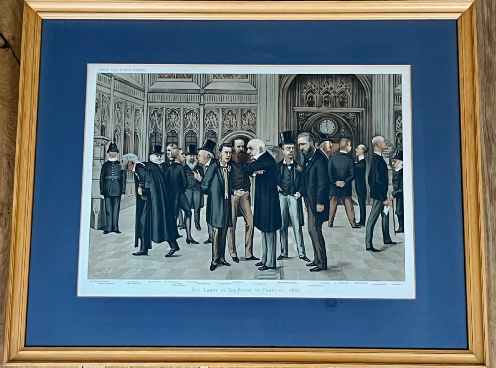 A framed 19th-century Vanity Fair chromolithograph featuring political caricatures by Spy set within a terracotta mount and wooden frame. View V