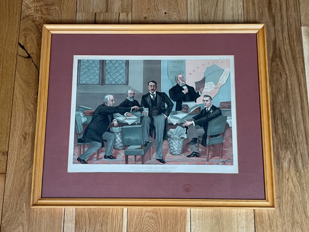 A framed 19th-century Vanity Fair chromolithograph featuring political caricatures by Spy set within a terracotta mount and wooden frame. View X