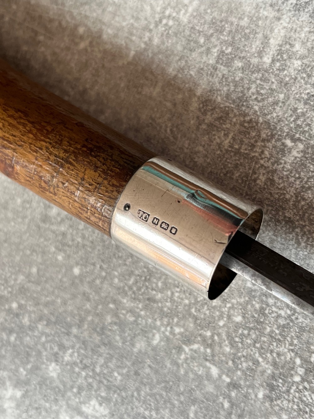 An antique chestnut wood sword stick shown unsheathed beside its shaft, featuring a root ball knob handle, silver collar mount, and long steel blade. View IV