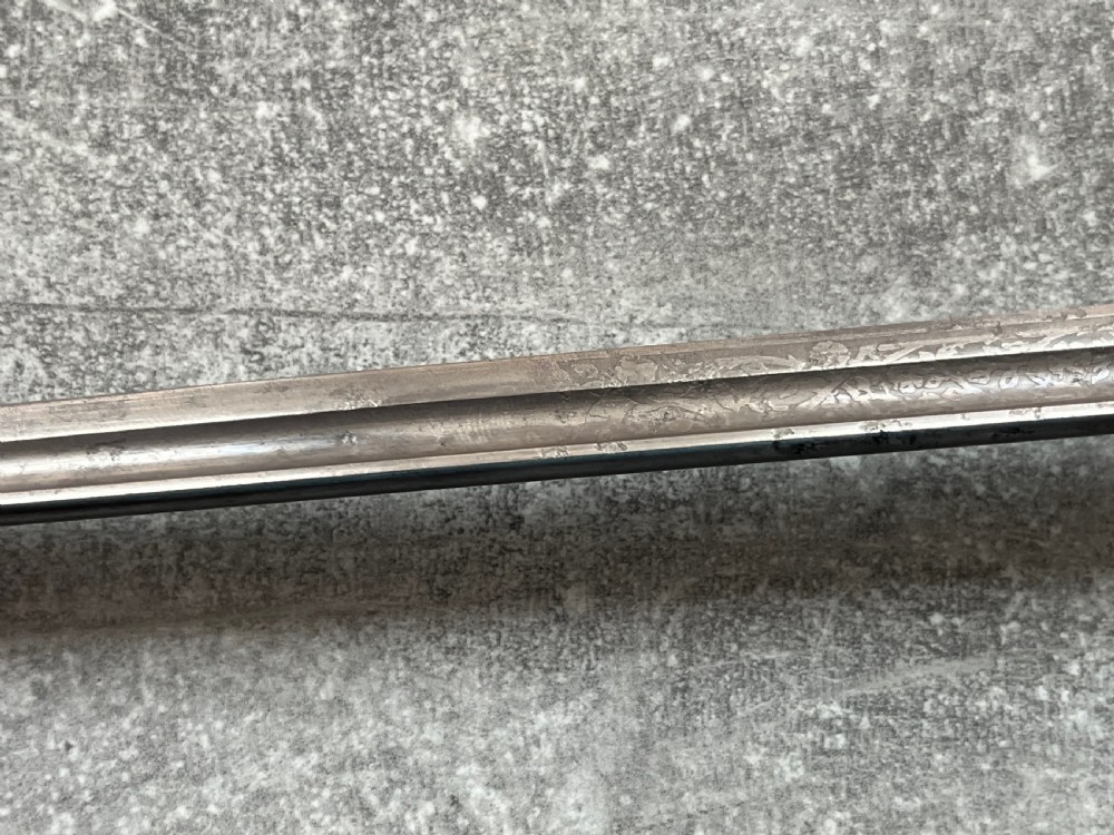 An antique chestnut wood sword stick shown unsheathed beside its shaft, featuring a root ball knob handle, silver collar mount, and long steel blade. View VI