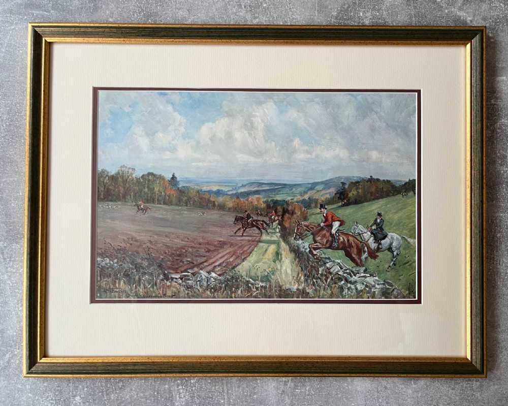 A set of four framed colour prints depicting fox hunting scenes in cream mounts and dark wood frames with gilt trim. View II