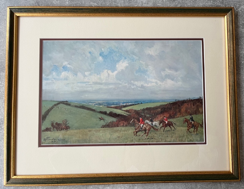 A set of four framed colour prints depicting fox hunting scenes in cream mounts and dark wood frames with gilt trim. View VI