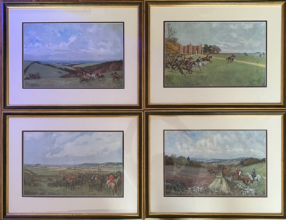 A set of four framed colour prints depicting fox hunting scenes in cream mounts and dark wood frames with gilt trim. View X