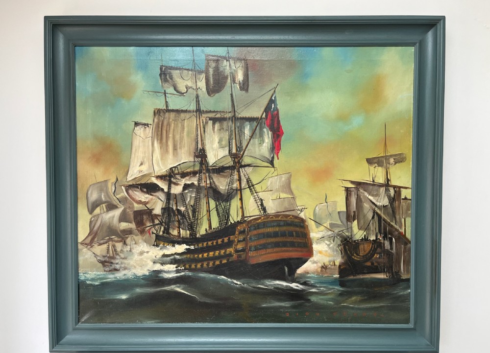 An oil painting on canvas portraying a sea battle between historical tall ships, presented in a grey-blue wooden frame.