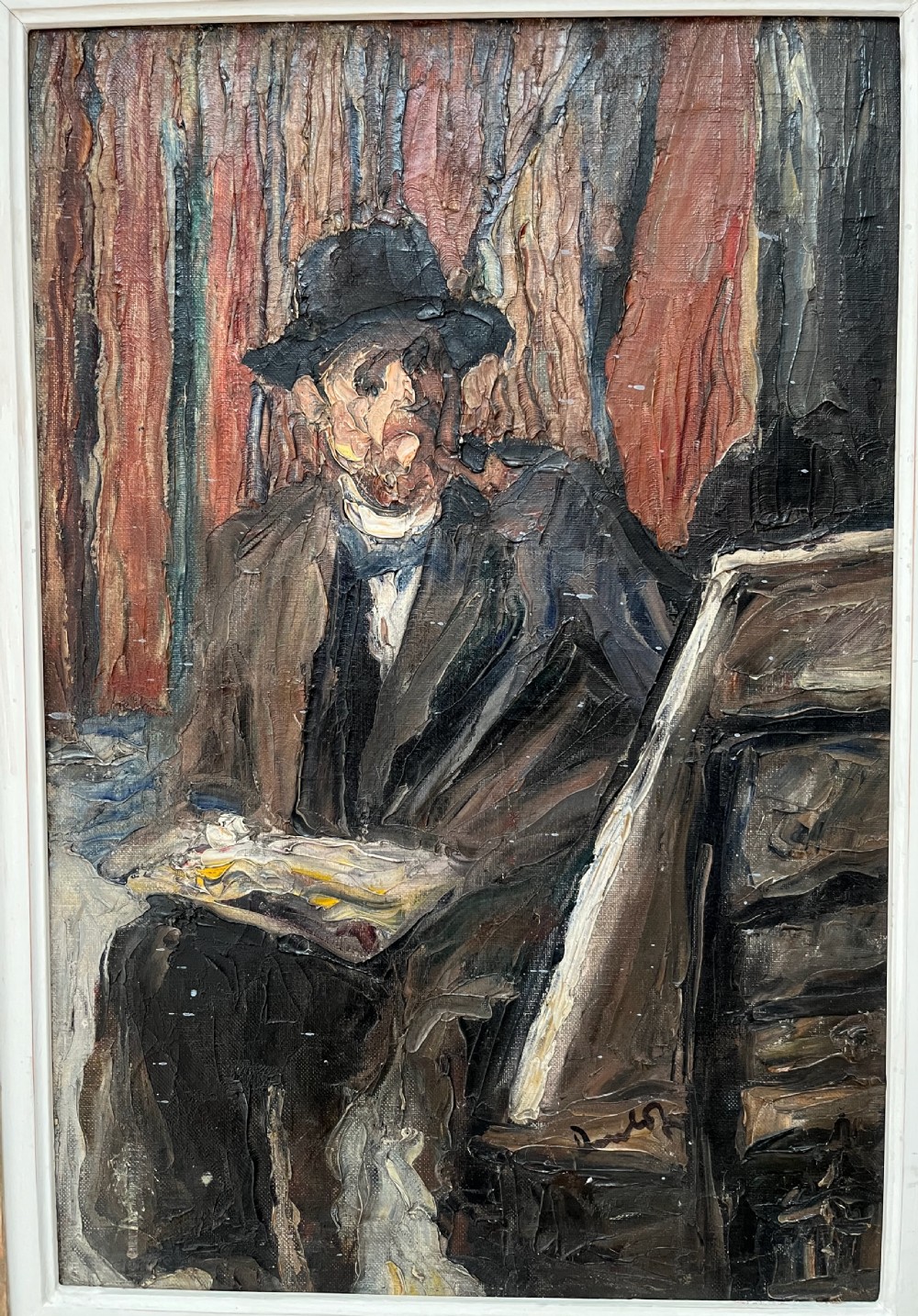 A framed post-impressionist oil painting depicting a seated artist wearing a hat while holding a palette. View II