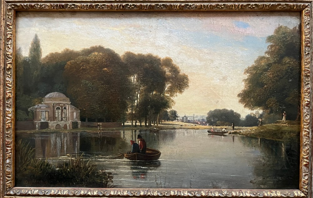 A 19th-century oil painting on board depicting figures in a rowboat on a calm river flanked by trees and classic architecture, housed in an ornate giltwood frame. View IV