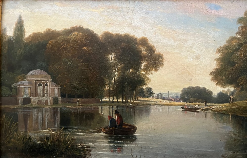 A 19th-century oil painting on board depicting figures in a rowboat on a calm river flanked by trees and classic architecture, housed in an ornate giltwood frame. View V