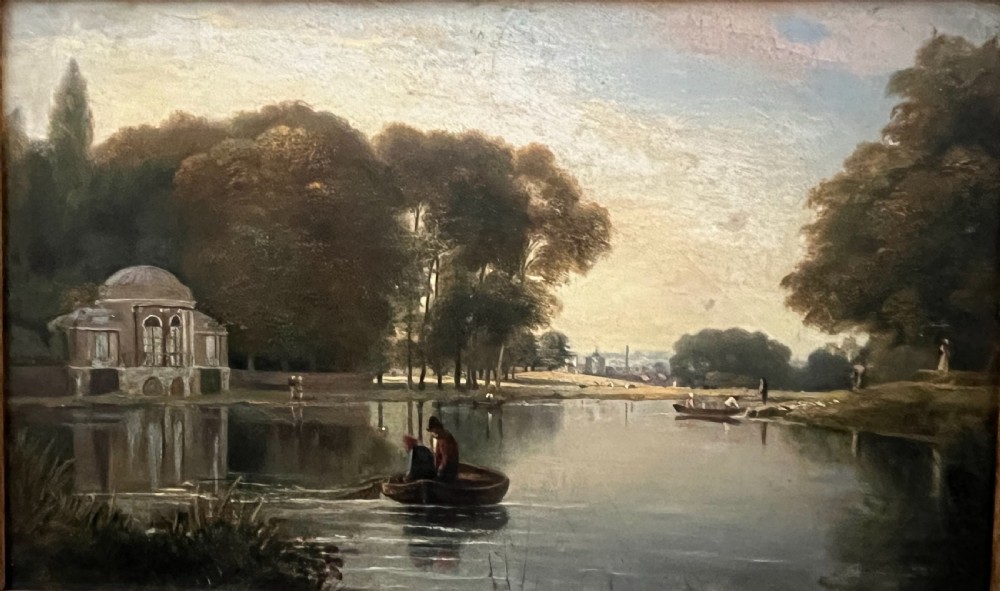 A 19th-century oil painting on board depicting figures in a rowboat on a calm river flanked by trees and classic architecture, housed in an ornate giltwood frame. View X