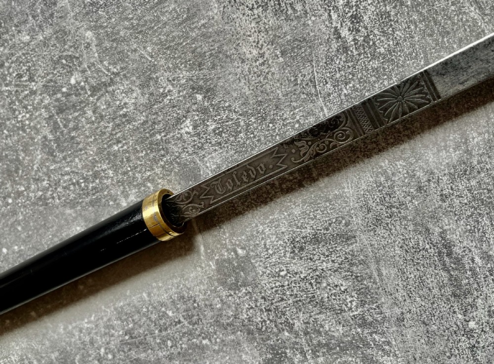 A Victorian ebonised wood walking stick shown in two parts alongside a slender concealed steel Toledo blade. View VI