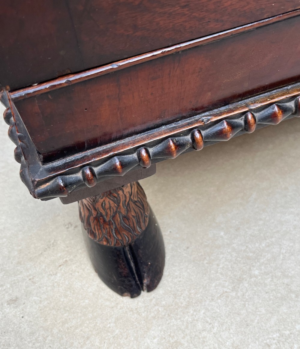 A pair of antique Regency mahogany side cabinets featuring brass lattice glazed doors and carved cloven hoof feet. View VIII
