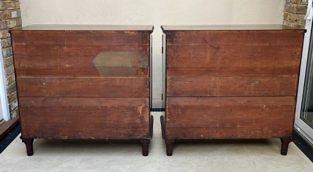 A pair of antique Regency mahogany side cabinets featuring brass lattice glazed doors and carved cloven hoof feet. View XI