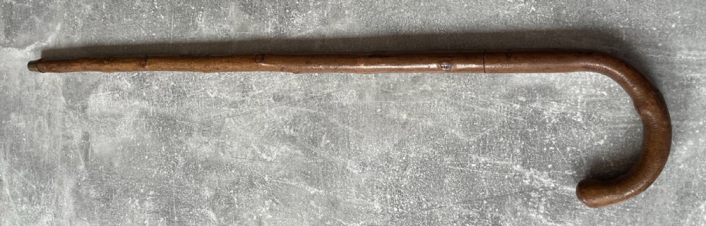 An antique hazel wood crook-handled walking stick shown unsheathed beside its concealed etched steel blade. View XV