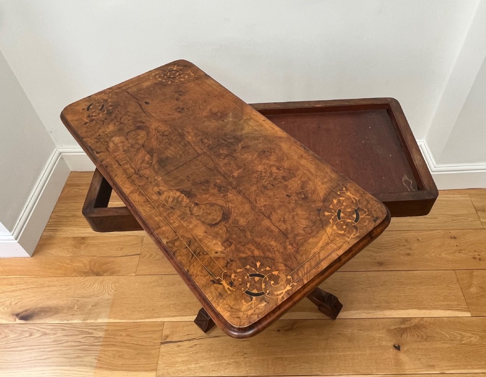 A Victorian burr walnut card table with an unfolded green baize surface resting on a carved pedestal base. View II