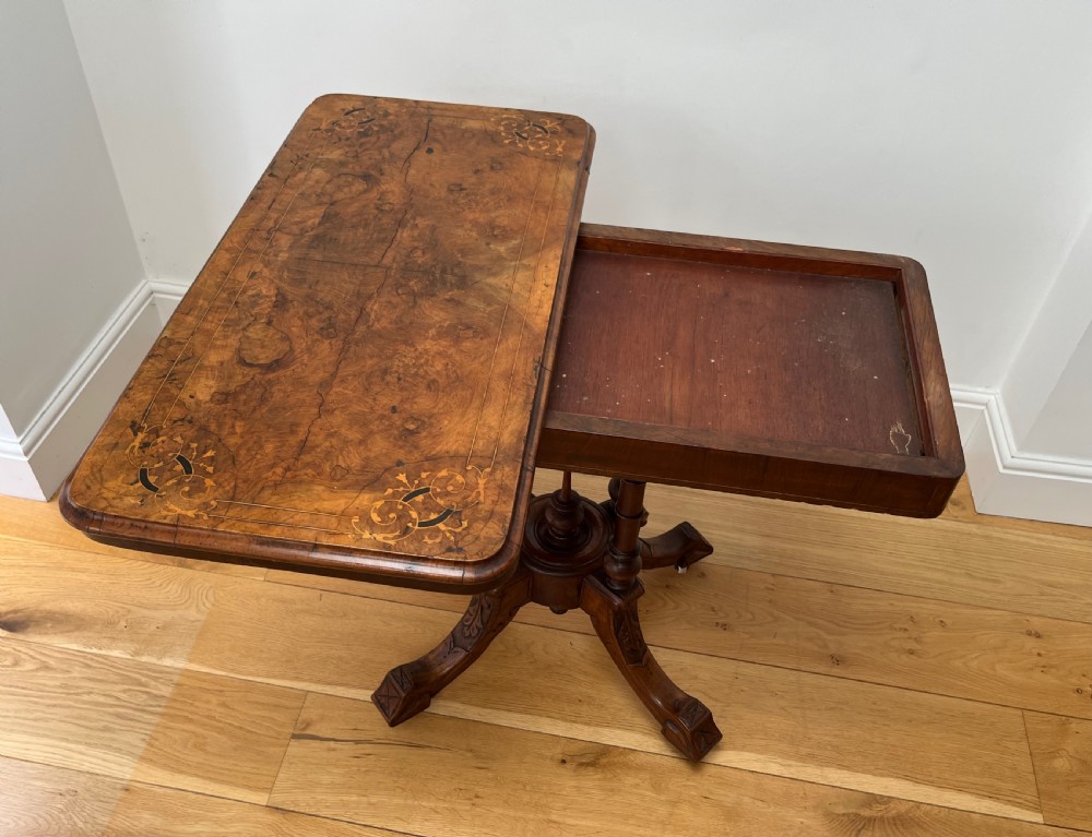 A Victorian burr walnut card table with an unfolded green baize surface resting on a carved pedestal base. View IX