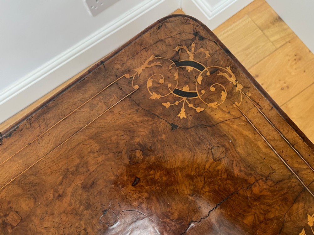 A Victorian burr walnut card table with an unfolded green baize surface resting on a carved pedestal base. View XV