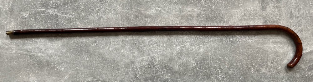 An antique cherrywood sword stick featuring a curved crook handle, a dark polished wood shaft, and a drawn steel blade with etched markings. View XV
