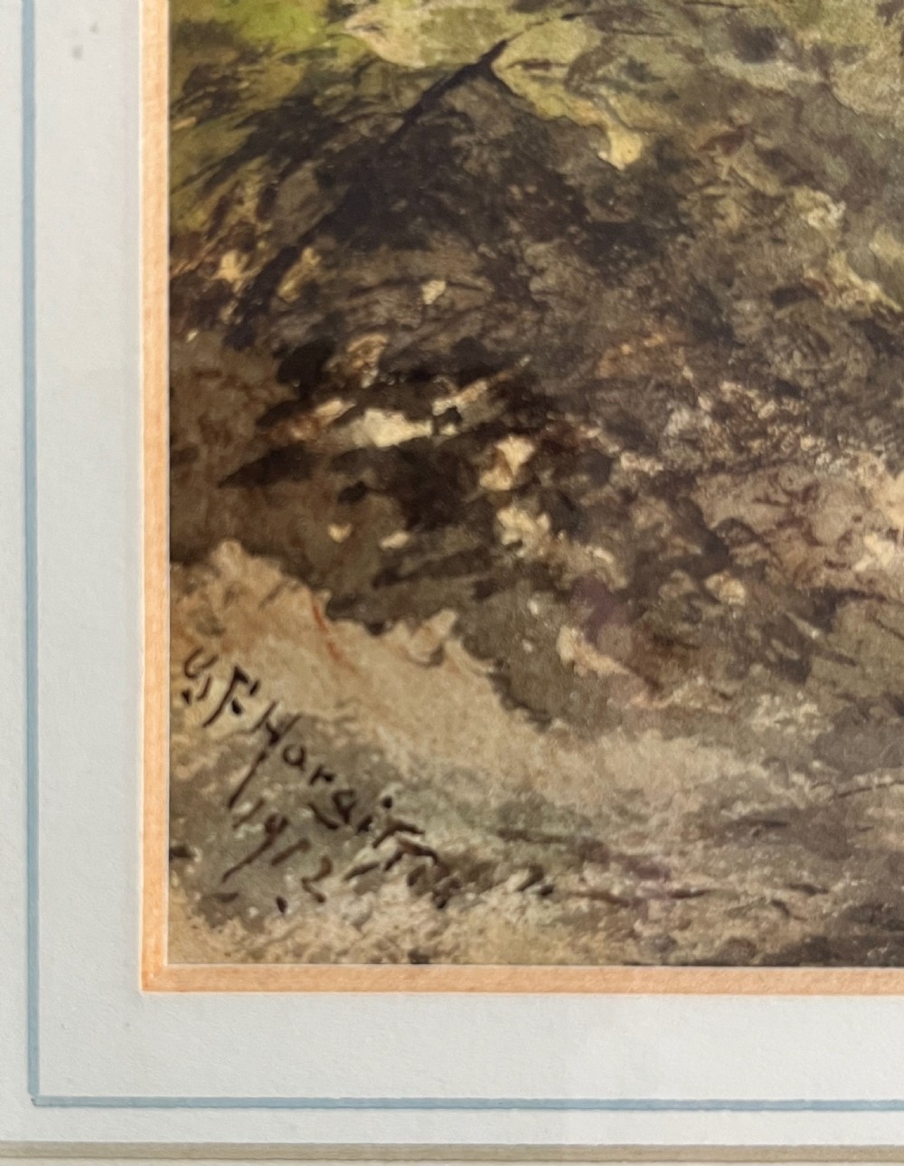 A framed 19th-century watercolour painting depicting a wooded countryside path under a clouded sky, mounted in a lined cream mat and narrow gilt-trimmed wooden frame. View III