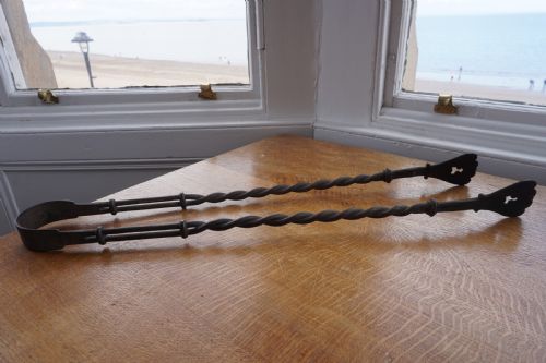 an interesting pair of wrought iron fire tongs probably late 17th or early 18th century - CATEGORY: ANTIQUE FIREPLACES - DATED 17TH CENTURY