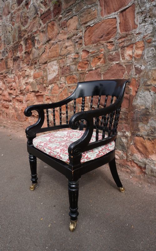 A SCOTTISH GEORGE IV EBONISED LIBRARY BERGERE ARMCHAIR - ADDITIONAL PHOTO 1