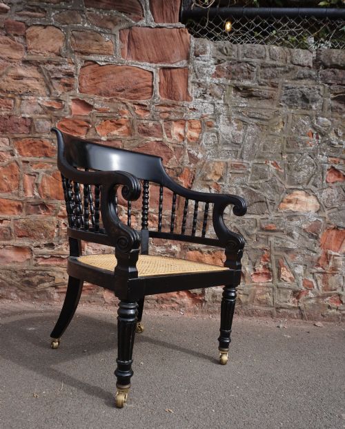 a scottish george iv ebonised library bergere armchair - CATEGORY: ANTIQUE CHAIRS - DATED REGENCY