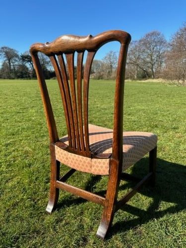 A VERY RARE GEORGE III ELM LOW CHAIR EDINBURGH 1770S