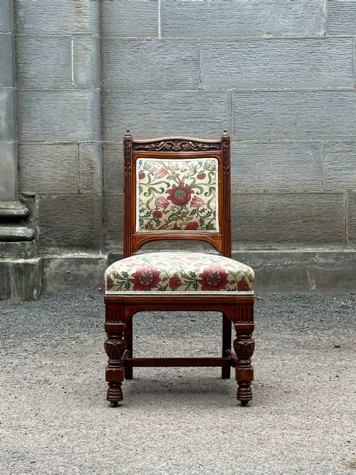 IN THE MANNER OF BRUCE TALBERT 18381881 A CARVED WALNUT LIBRARY CHAIR 1870'S - ADDITIONAL PHOTO 2
