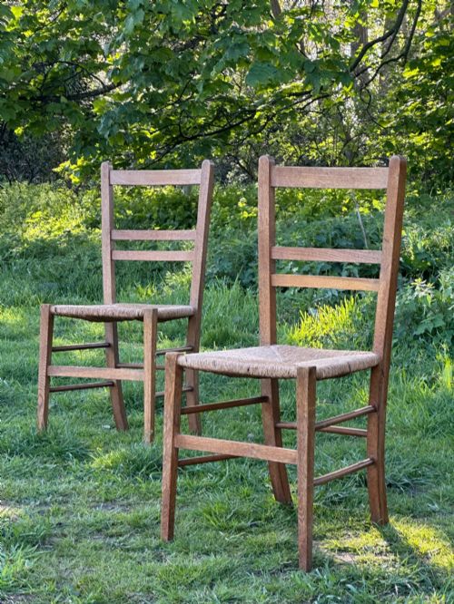 a pair of arts and crafts oak and rush seated chairs in the manner of heals - CATEGORY: ANTIQUE CHAIRS - DATED 1910