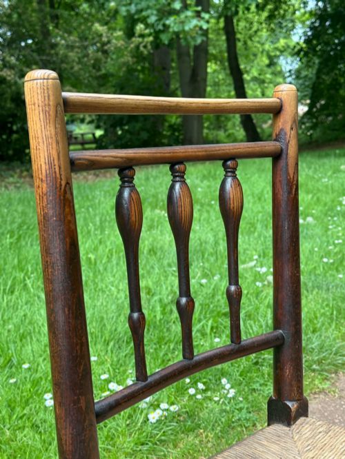 A SMALL GEORGE III LANCASHIRECHESHIRE STAINED ASH AND WOVEN RUSH ROCKING CHAIR - ADDITIONAL PHOTO 3