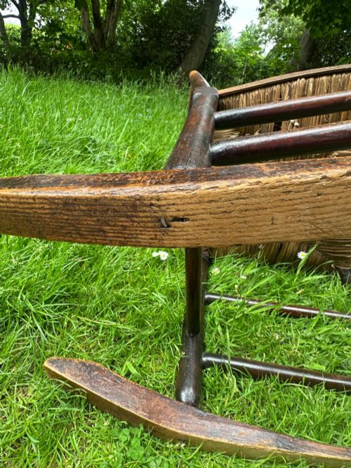 A SMALL GEORGE III LANCASHIRECHESHIRE STAINED ASH AND WOVEN RUSH ROCKING CHAIR - ADDITIONAL PHOTO 6
