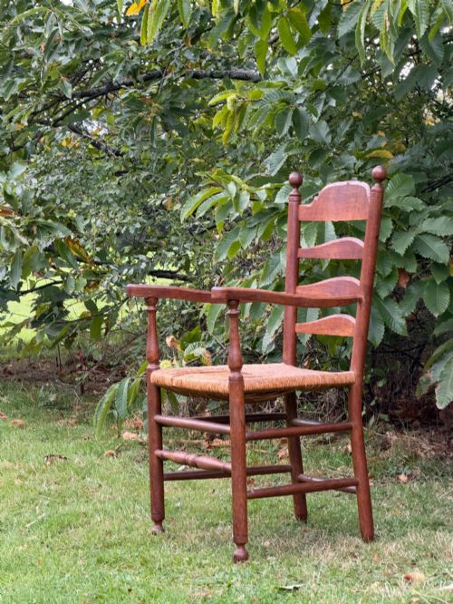 An Anglo-indian Teak Rush-seated Armchair, Early 20th Century