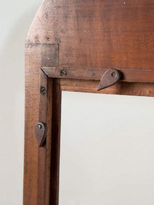 fig 1. A freestanding Anglo-Indian carved walnut screen frame featuring an arched floral crest and splayed scrolled feet.