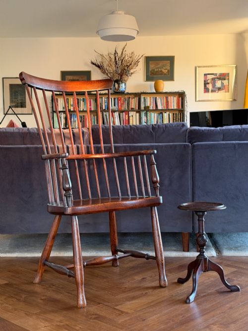 fig 1. A late 19th-century George III style dark mahogany kettle stand with a circular dish top, spiral-carved baluster column, and tripod cabriole legs.