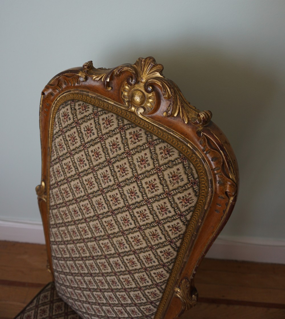 A 19th century walnut and carved giltwood slipper chair c.1880 attributed to Morison & Co. View X
