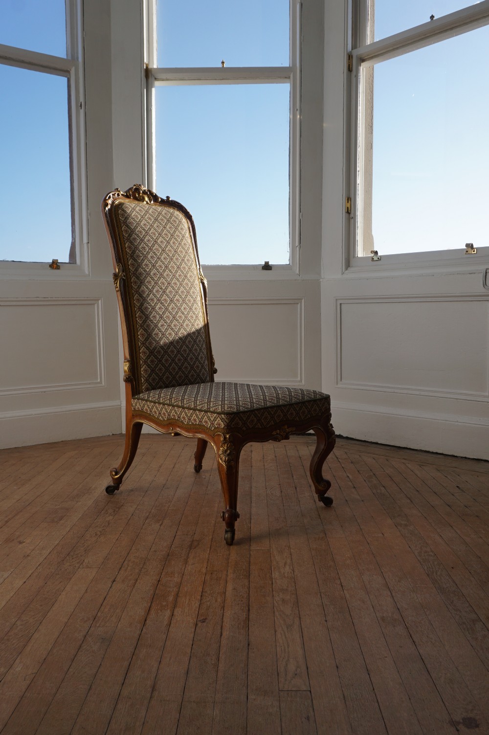 A 19th century walnut and carved giltwood slipper chair c.1880 attributed to Morison & Co. View XI