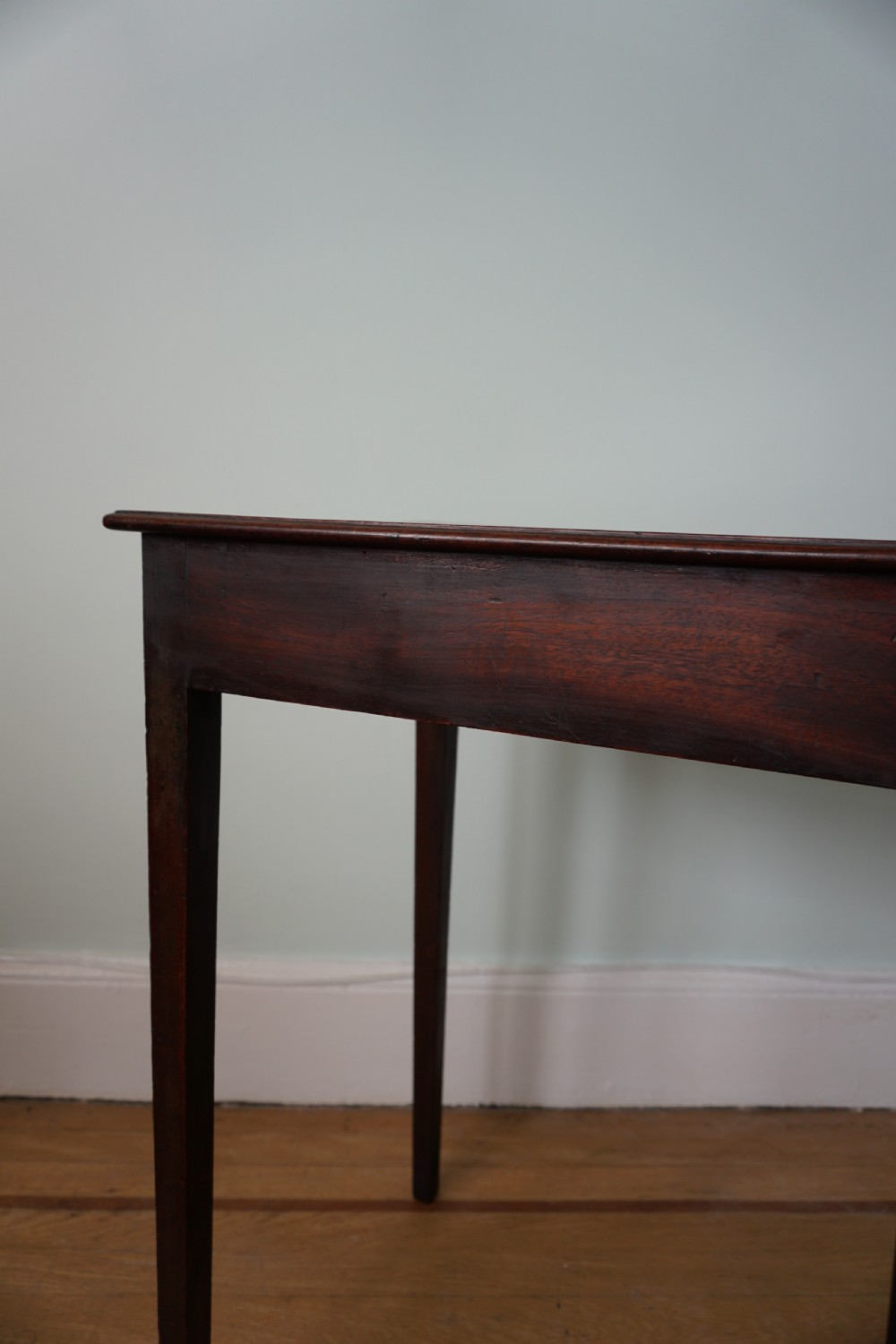 An unusual Scottish George III mahogany writing table, of small proportions, probably made in Edinburgh View V