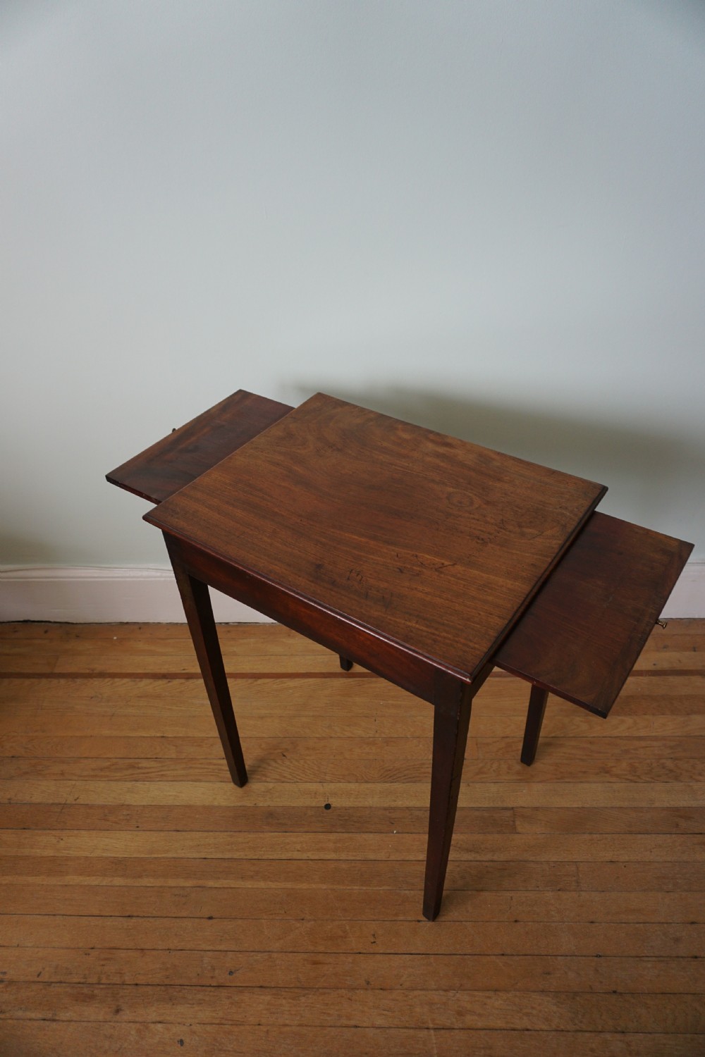 An unusual Scottish George III mahogany writing table, of small proportions, probably made in Edinburgh View X