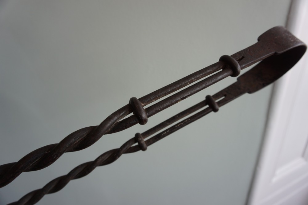 An interesting pair of wrought iron fire tongs, probably late 17th or early 18th century View III