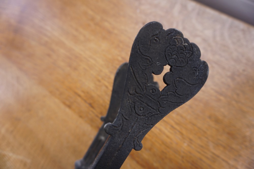 An interesting pair of wrought iron fire tongs, probably late 17th or early 18th century View IV