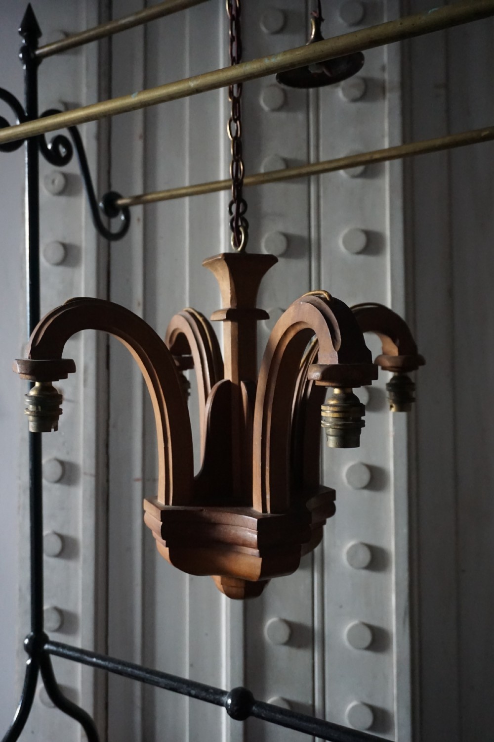 Attributed to Sir Robert Lorimer (1864-1929) An Arts and Crafts carved walnut ceiling pendant