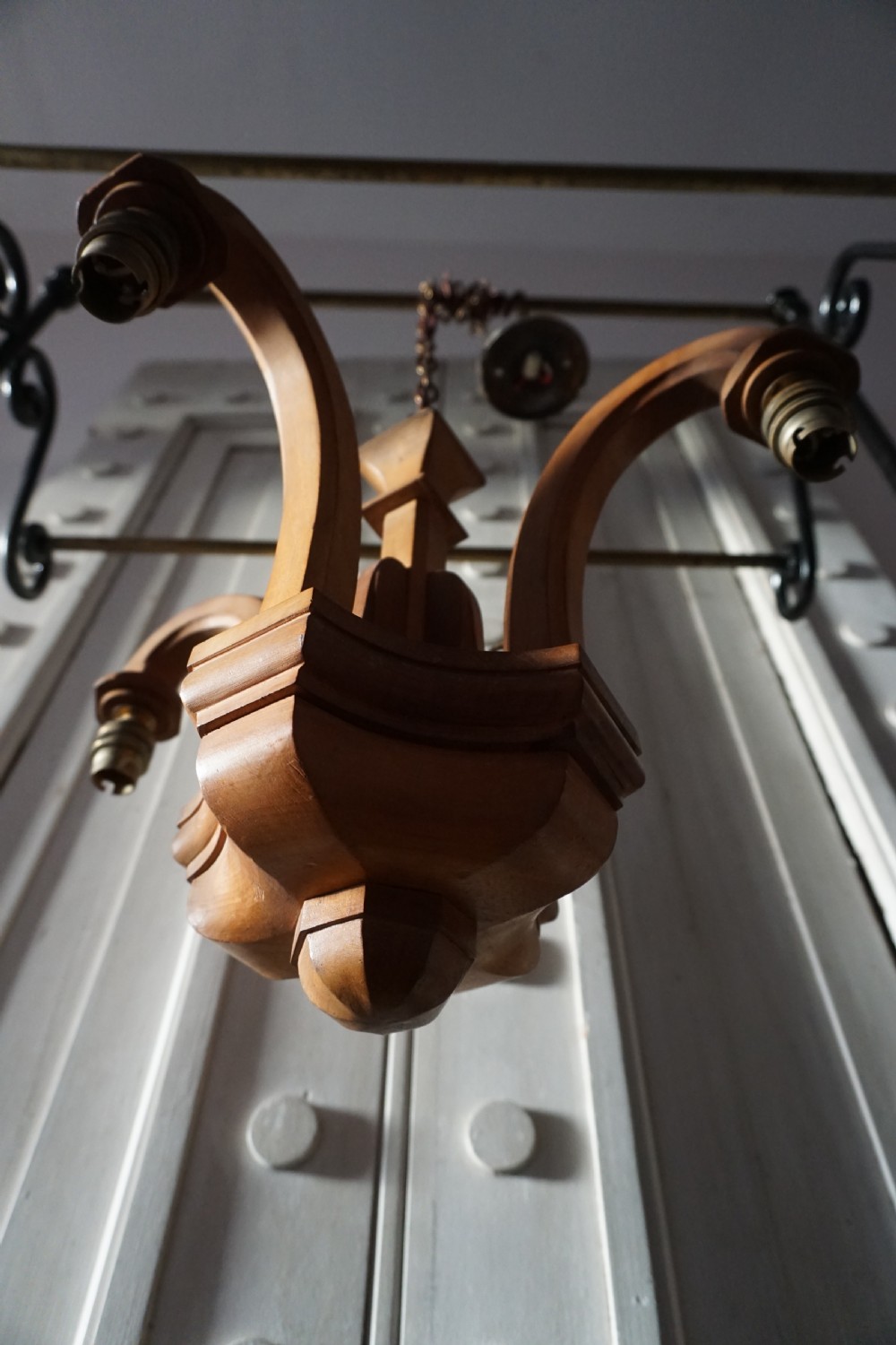 Attributed to Sir Robert Lorimer (1864-1929) An Arts and Crafts carved walnut ceiling pendant View II