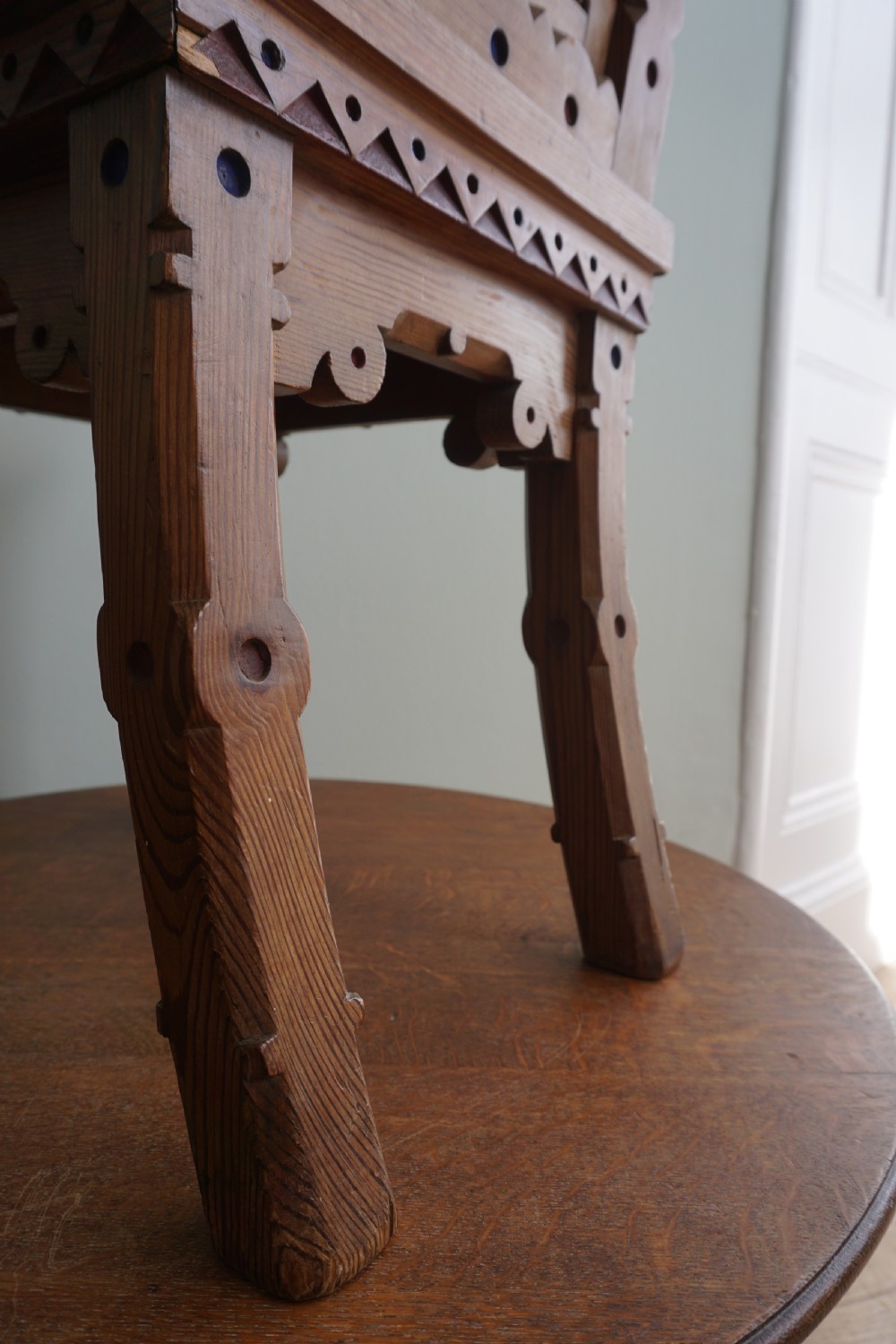 A pitch pine and coloured enamel Gothic Revival hall chair in the manner of Bruce Talbert, 1860s View III