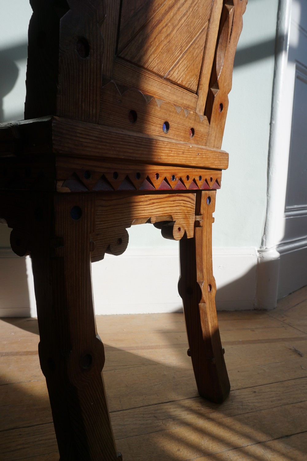 A pitch pine and coloured enamel Gothic Revival hall chair in the manner of Bruce Talbert, 1860s View VII