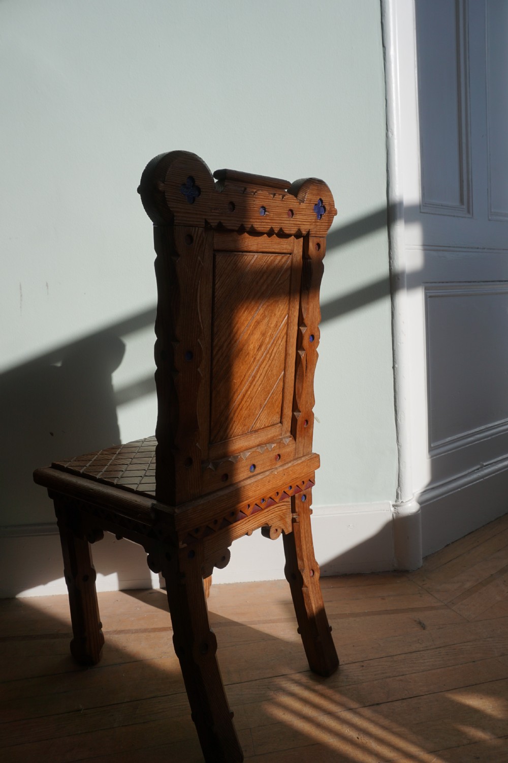 A pitch pine and coloured enamel Gothic Revival hall chair in the manner of Bruce Talbert, 1860s View VIII
