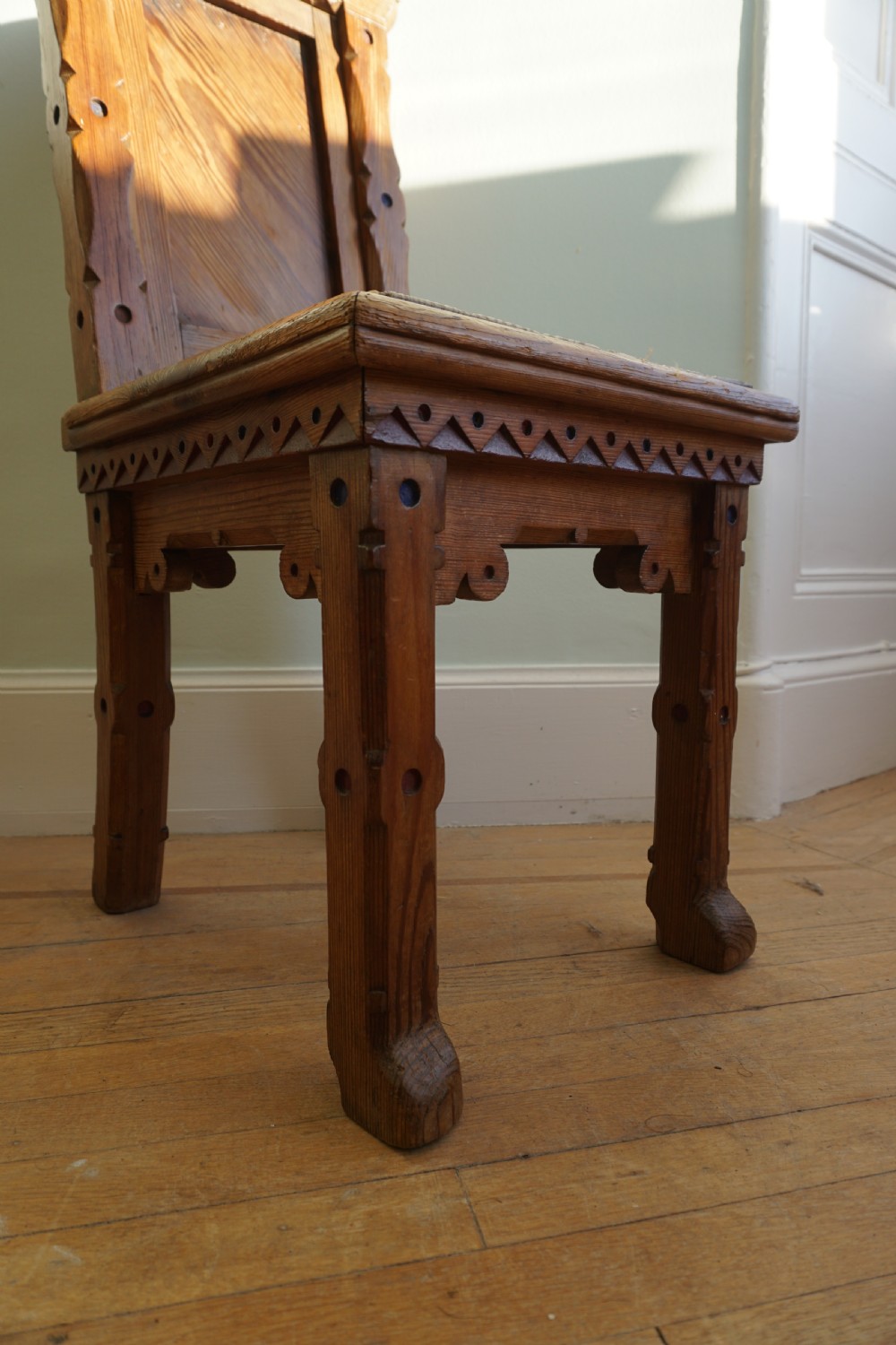 A pitch pine and coloured enamel Gothic Revival hall chair in the manner of Bruce Talbert, 1860s View XI