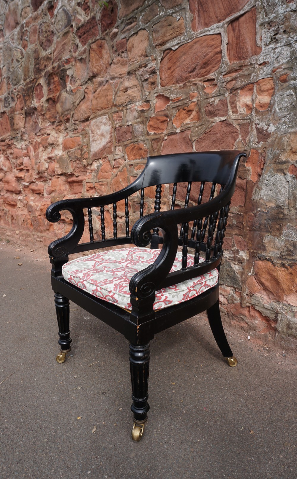 A Scottish George IV ebonised library bergere armchair View II