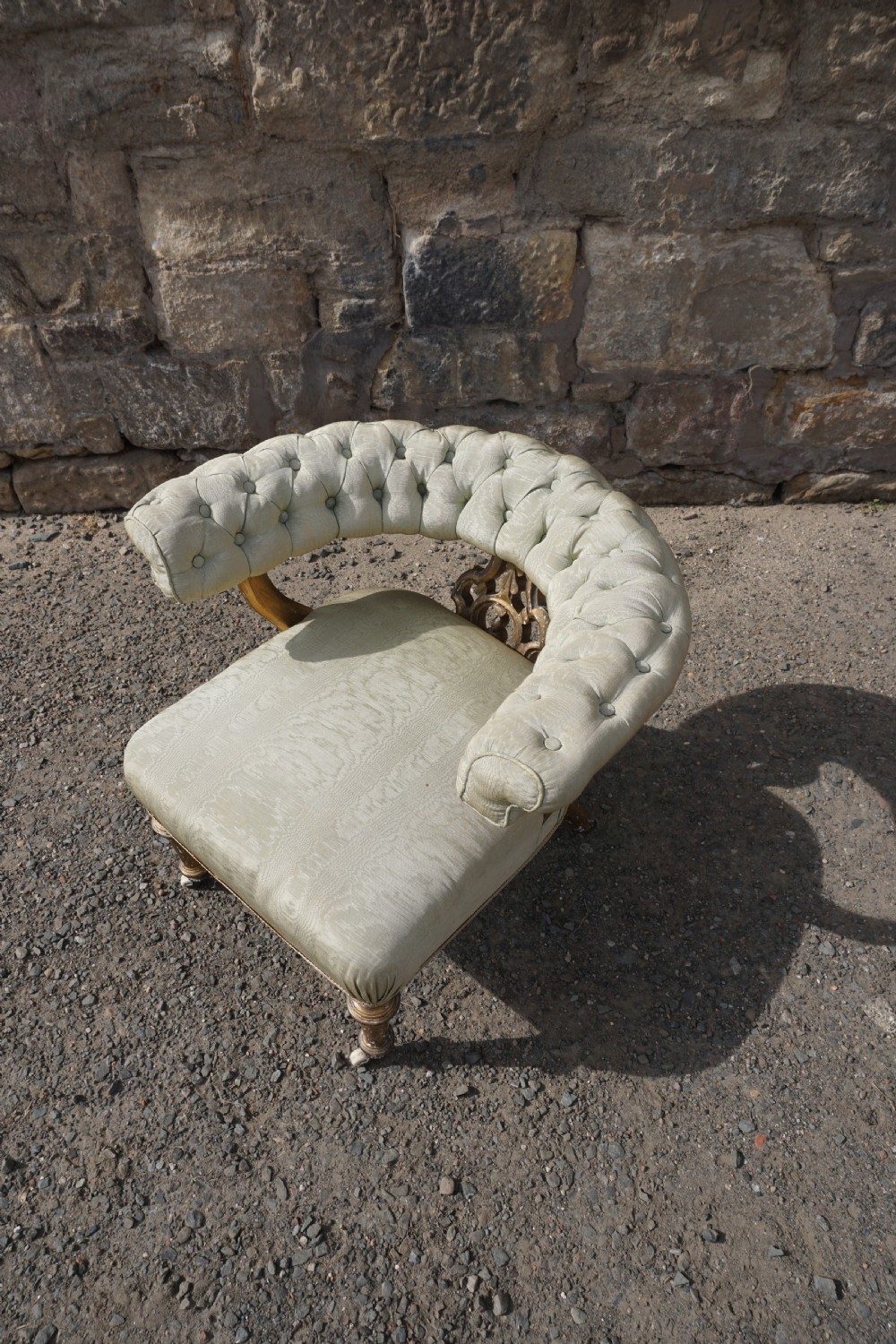 A Victorian giltwood tub chair by Holland & Sons of London View VII