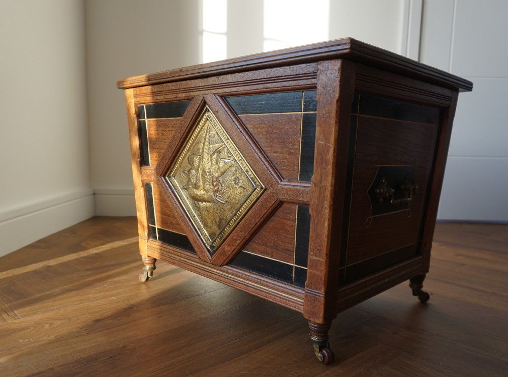 An Aesthetic Movement walnut sarcopagus-shaped coal box or cellaret by Holland & Sons or similar, 1880s. View II