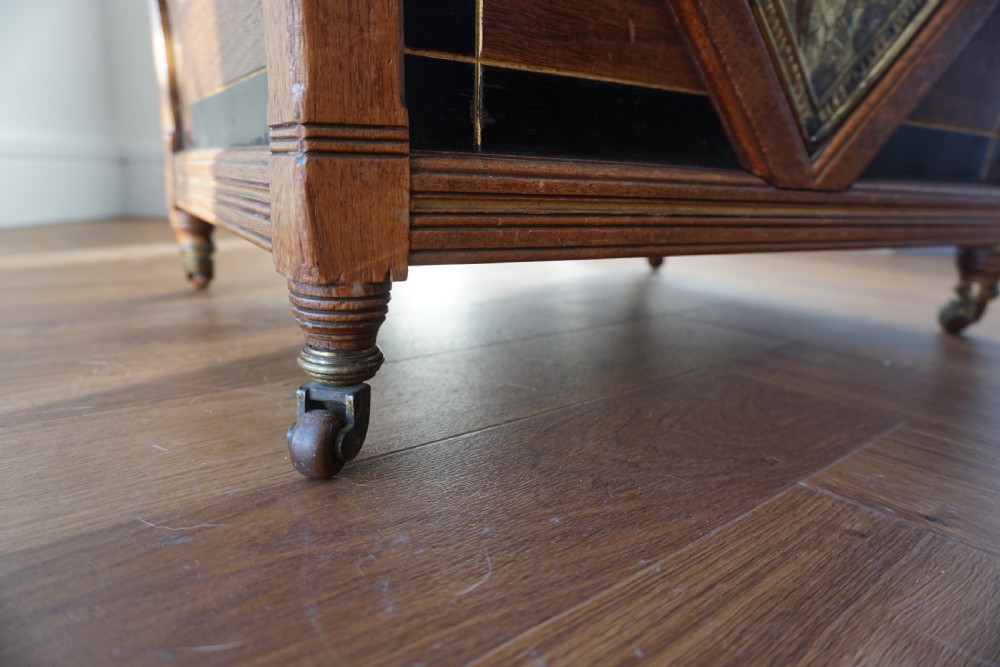 An Aesthetic Movement walnut sarcopagus-shaped coal box or cellaret by Holland & Sons or similar, 1880s. View VI